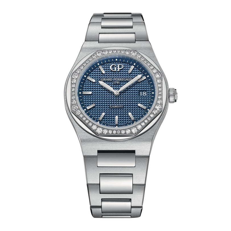 The Girard-Perregaux Laureato 34 is a stainless steel watch featuring a blue textured dial, octagonal diamond-set bezel, date display at 3 o’clock, and a metal link bracelet.
