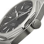 Close-up of a Girard-Perregaux Laureato 42 watch with an octagonal bezel, textured black dial, silver hands and markers, and a crown engraved with the GP logo.