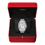 A Santos de Cartier silver wristwatch by Cartier, featuring a square steel case and Roman numerals, is shown in an open red Cartier box with a black interior.