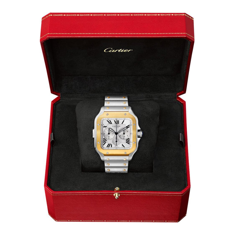 A Santos de Cartier Chronograph watch with a metal band is displayed in an open red Cartier box featuring a black velvet interior.