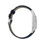 Side view of the Cartier Santos-Dumont watch with a blue leather strap and a silver rectangular case, highlighting the buckle, slim profile, and refined mechanical movement.