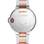 Back view of the Ballon Bleu de Cartier watch by Cartier, featuring a stainless steel and rose gold bracelet, engraved case details, blue crown accent, and a glimpse of its elegant guilloché dial.