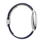 A side view of the Cartier Ballon Bleu de Cartier watch with a slim silver case, blue guilloché dial, and blue leather strap, displayed against a white background.