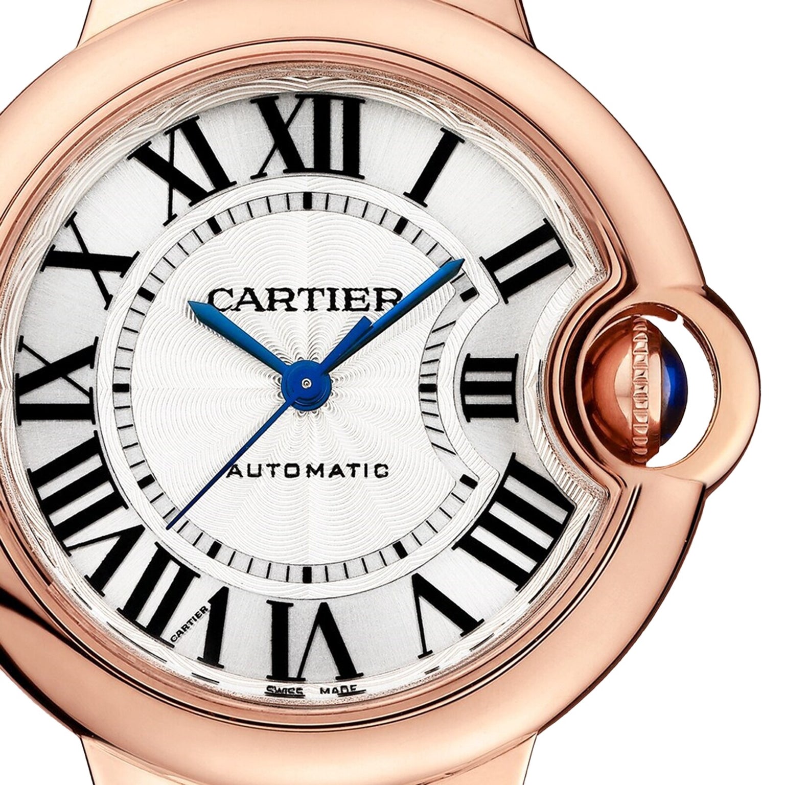 Close-up of the Cartier Ballon Bleu de Cartier watch featuring a white dial, black Roman numerals, blue hands, and a rose gold case with a cabochon sapphire crown.
