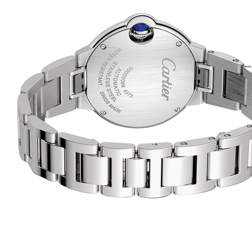 A close-up of the back of the Cartier Ballon Bleu de Cartier watch highlights its engraved details, stainless steel finish, blue cabochon crown, and self-winding movement.