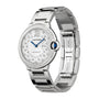 The Cartier Ballon Bleu de Cartier is a silver automatic watch with diamond markers, Roman numerals, a sunray grey dial, gem-set crown, and interchangeable steel bracelet.