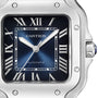 Close-up of the Santos de Cartier by Cartier, showcasing its blue square dial with Roman numerals, silver hands, and AUTOMATIC above 6 o’clock—all in a refined square steel case inspired by aviator Alberto Santos-Dumont.