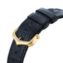 Close-up of a black leather Tank Américaine watch strap by Cartier with a gold buckle, showcasing textured detailing and precise stitching.