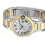 The Ballon Bleu de Cartier by Cartier features a round silver dial with Roman numerals and blue hands, plus a two-tone metal bracelet in 18K yellow gold and silver links.