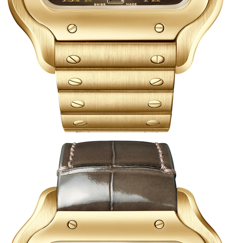Close-up of two Cartier Santos de Cartier 18K yellow gold watch cases: one with a gold metal link bracelet featuring the SmartLink adjustment system, the other with a stitched dark leather strap, both set against a white background.