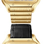 Close-up of a Cartier Santos de Cartier Skeleton watch, showing its gold case with a metal bracelet above and a black leather strap below, both partially visible.