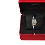 The Cartier Tank Américaine watch features a rectangular face and blue strap, highlighting its luxurious design, and is elegantly presented in a red, velvet-lined Cartier box.