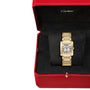 A Cartier Tank Française wristwatch with Roman numeral markers on a rectangular dial, presented in a red Cartier box lined with black fabric.