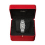 The Cartier Tank Must de Cartier is a silver rectangular wristwatch with a white face, Roman numerals, and quartz movement, presented in a red Cartier box lined with black velvet.