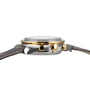 Side view of the OMEGA Speedmaster Moonphase wristwatch with a two-tone metal case, 18K yellow gold pushers and crown, paired elegantly with a brown leather strap.