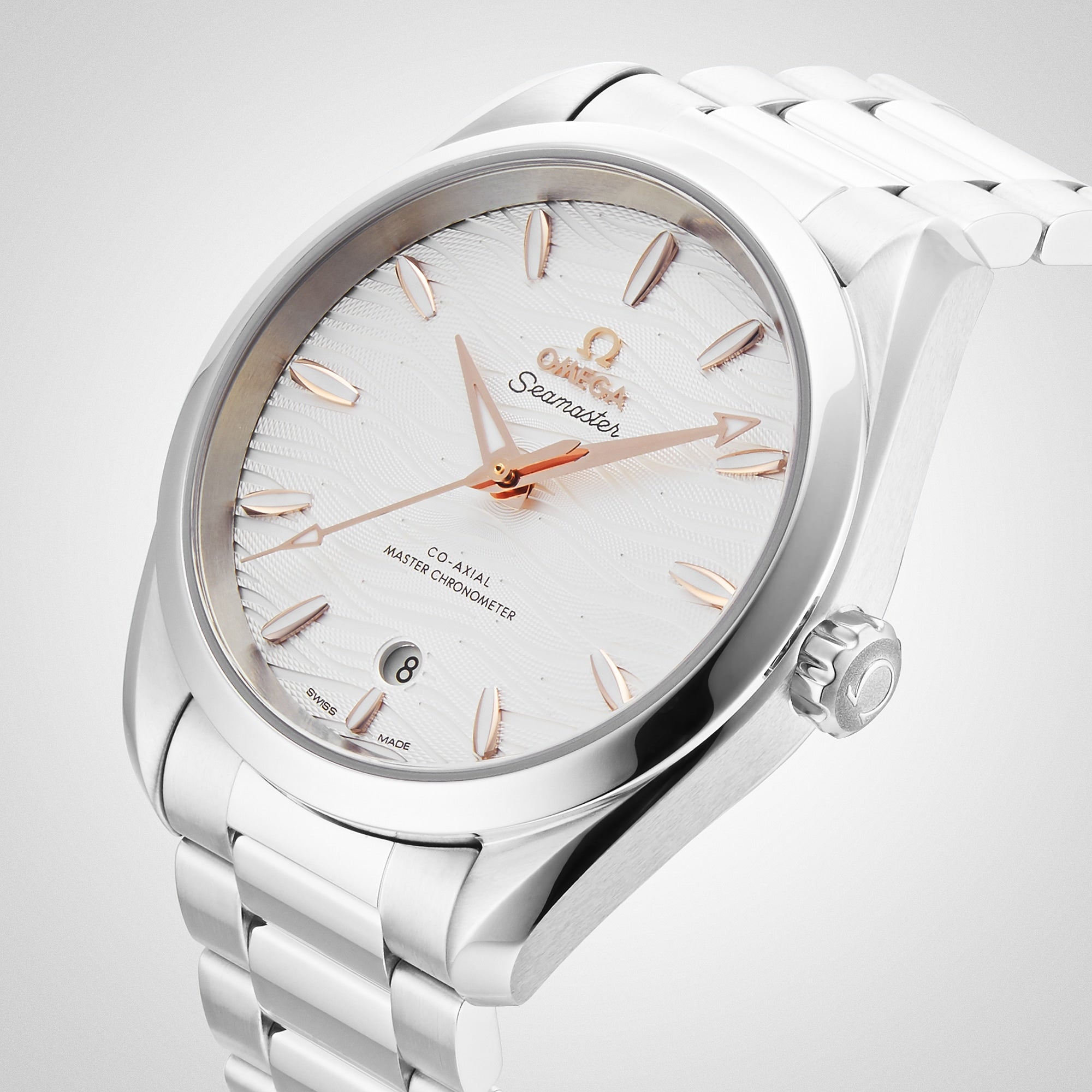 OMEGA Seamaster Aqua Terra 150M wristwatch with a white patterned dial, rose gold markers and hands, and a metal bracelet, displayed at an angle.
