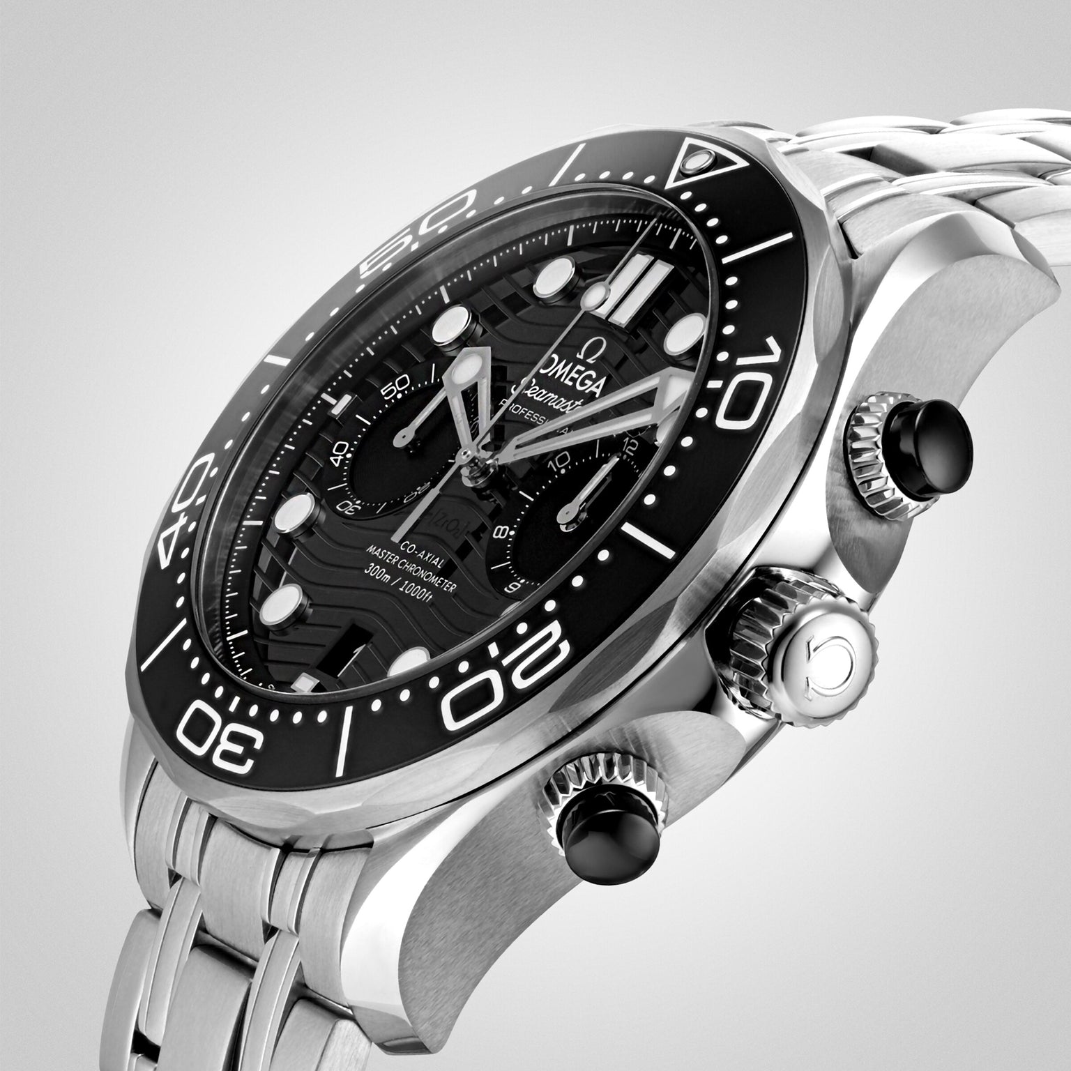 A close-up of the OMEGA Seamaster Diver 300M, featuring a stainless steel case, black bezel, black dial, silver hour markers, and chronograph pushers, shown at an angle.