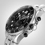 A close-up of the OMEGA Seamaster Diver 300M, featuring a stainless steel case, black bezel, black dial, silver hour markers, and chronograph pushers, shown at an angle.