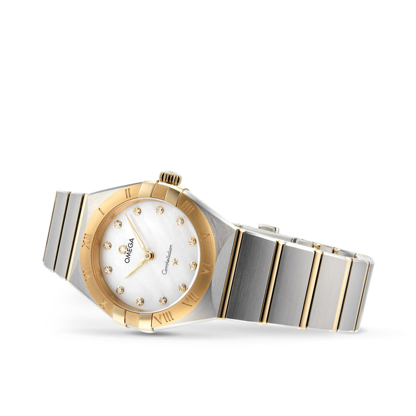 The OMEGA Constellation features an 18K yellow gold bezel, stainless steel band, and a white dial with gold hour markers and hands—a stylish precision timepiece.