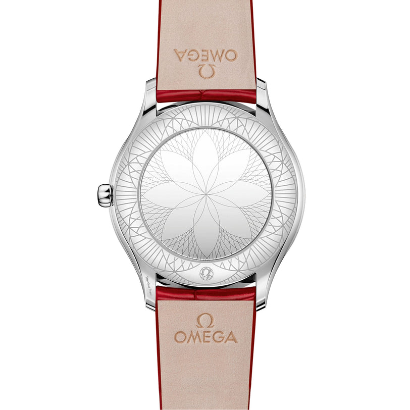 The back of the OMEGA De Ville Tresor 36 features a geometric floral pattern engraved on the case and red leather straps embossed with the OMEGA logo.