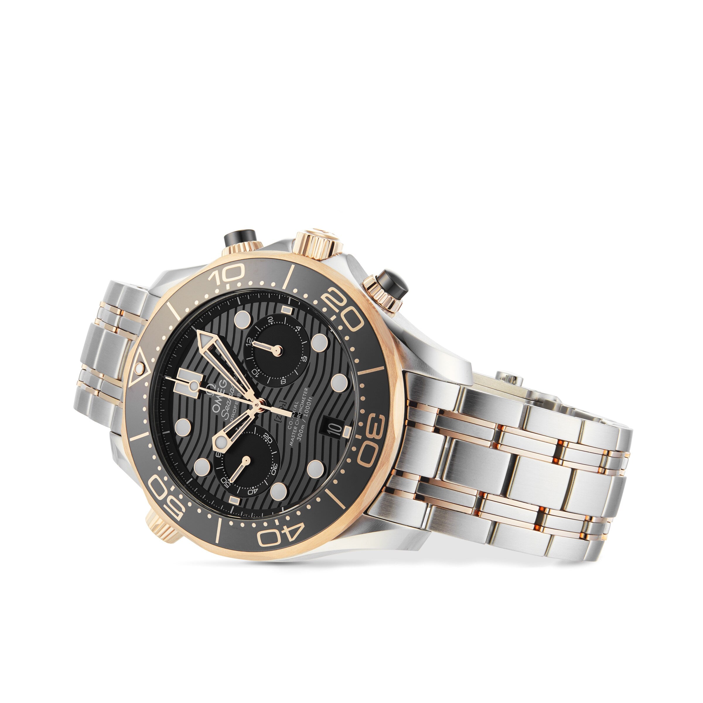 The OMEGA Seamaster Diver 300M wristwatch features a black dial, 18K Sedna™ gold and silver accents, three subdials, and a metal link bracelet, displayed against a white background.