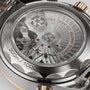 Close-up of the OMEGA Seamaster Diver 300M’s back reveals its mechanical movement, rotor, and engravings like 300m/1000ft, Master Chronometer, and Co-Axial 9900 in luxurious 18K Sedna™ gold.