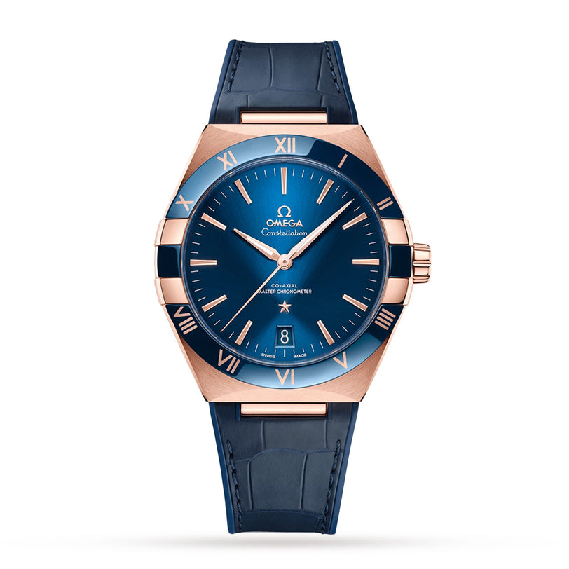 A blue OMEGA Constellation watch features a Sedna™ gold bezel with Roman numerals, a blue dial, and a blue leather strap, highlighting its iconic design against a white background.