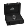 An OMEGA Speedmaster Moonwatch Professional, inspired by the 4th generation model, is displayed in an open black presentation box featuring the OMEGA logo on the inside lid.