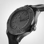 A close-up of the OMEGA Seamaster Diver 300M Black Black Edition with a textured black dial, black bezel, and rubber strap, displayed at an angle against a light background. Powered by the OMEGA Calibre 8800 movement.