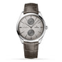 The OMEGA De Ville Trésor is a stainless steel wristwatch with a gray alligator leather strap, two subdials, and minimalist hour markers.