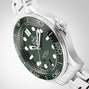 A close-up of an OMEGA Seamaster Diver 300M wristwatch, featuring a green bezel and dial, silver indices, and a stainless steel bracelet against a light gradient background.