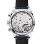 Back view of the OMEGA Speedmaster 57, showing a transparent case back that reveals its detailed mechanical movement and jewel bearings, with engraved text noting its Master Chronometer certification.