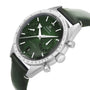 The OMEGA Speedmaster 57 is a stainless steel watch with a green dial, matching green leather strap, chronograph subdials, tachymeter bezel, and a certified Master Chronometer case.