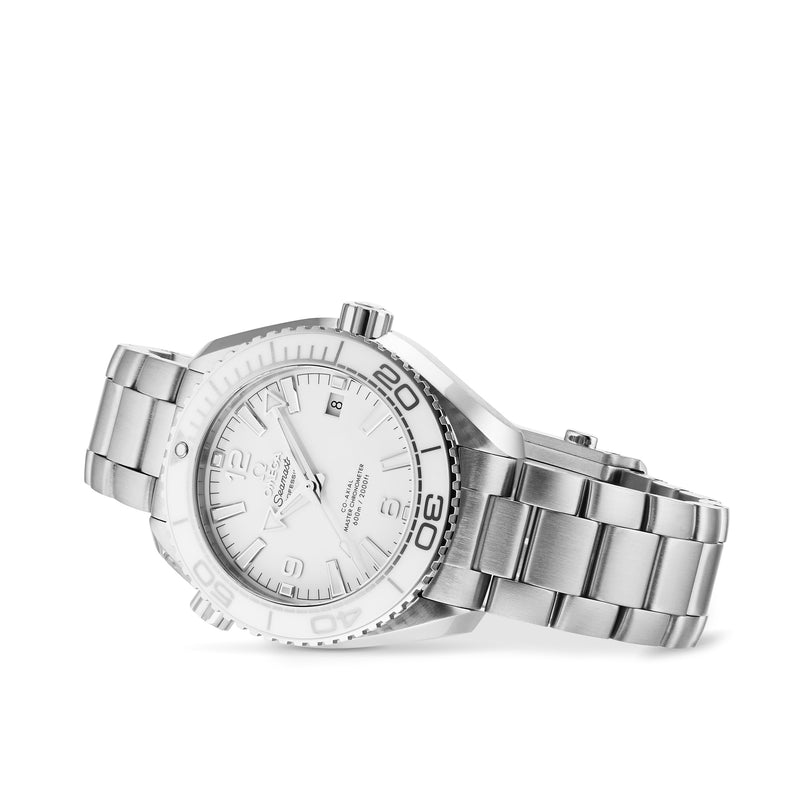 The OMEGA Seamaster Planet Ocean 600M wristwatch, with a white dial, date display, metal bracelet, and white ceramic bezel, is shown angled against a plain white background.