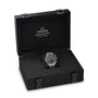 The OMEGA Speedmaster Super Racing, a luxury watch from the Speedmaster collection, is elegantly displayed in an open black presentation box with OMEGA Speedmaster branding on the inside lid.