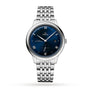 The OMEGA De Ville Prestige wristwatch features a blue dial with Roman numerals, date at 3 o’clock, OMEGA Master Co-Axial Calibre 8802, and a stainless steel bracelet—a timeless example of classical design.