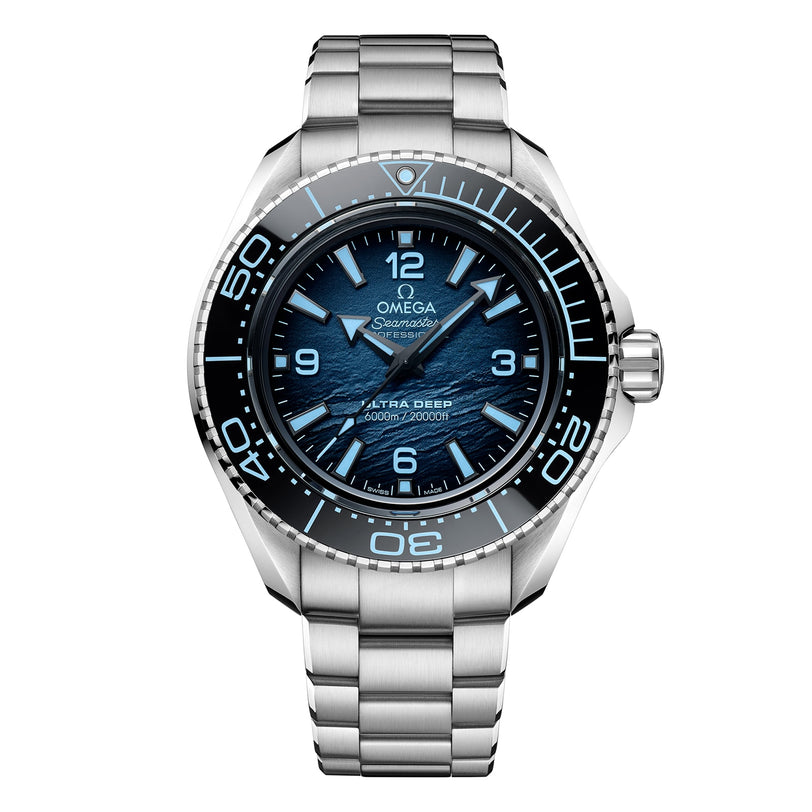The OMEGA Seamaster Planet Ocean 6000M in O-MEGASTEEL features a blue gradient dial, silver markers, and a metal bracelet—an iconic choice among saturation divers watches.