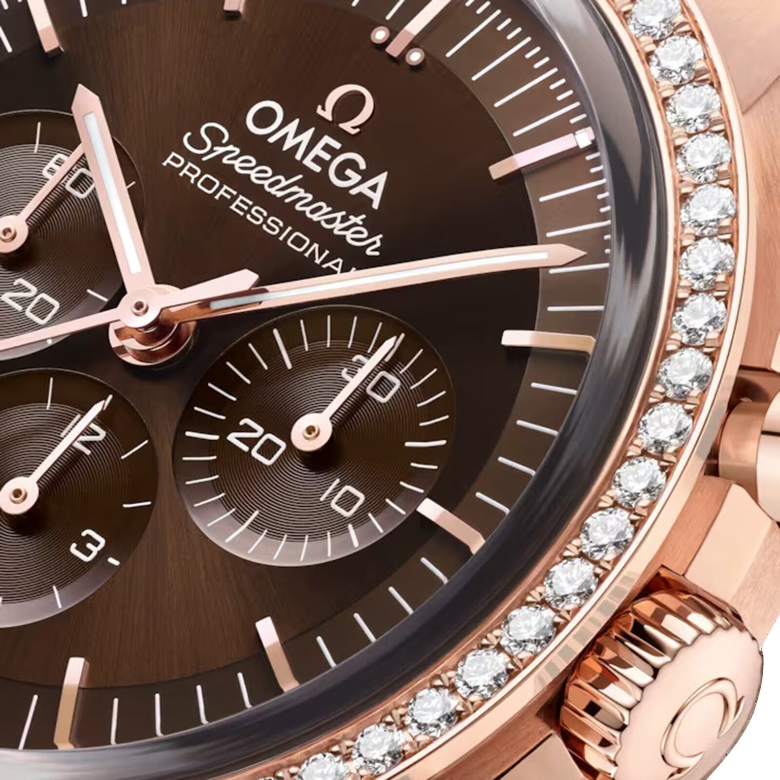 Close-up of the OMEGA Speedmaster Moonwatch Professional with a brown dial, three subdials, diamond-set 18K Sedna Gold bezel, and OMEGA Co-Axial Master Chronometer Calibre 3861 movement.