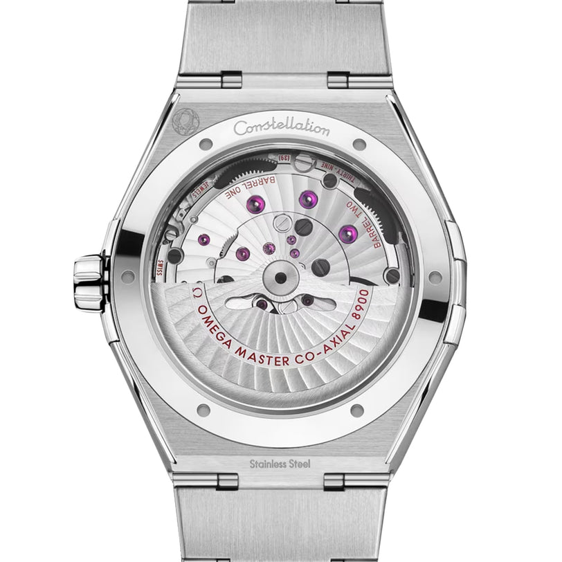 Back view of the OMEGA Constellation watch revealing its stainless steel case and the exposed Co-Axial Master Chronometer Calibre 8900 movement with labeled parts and visible jewels.