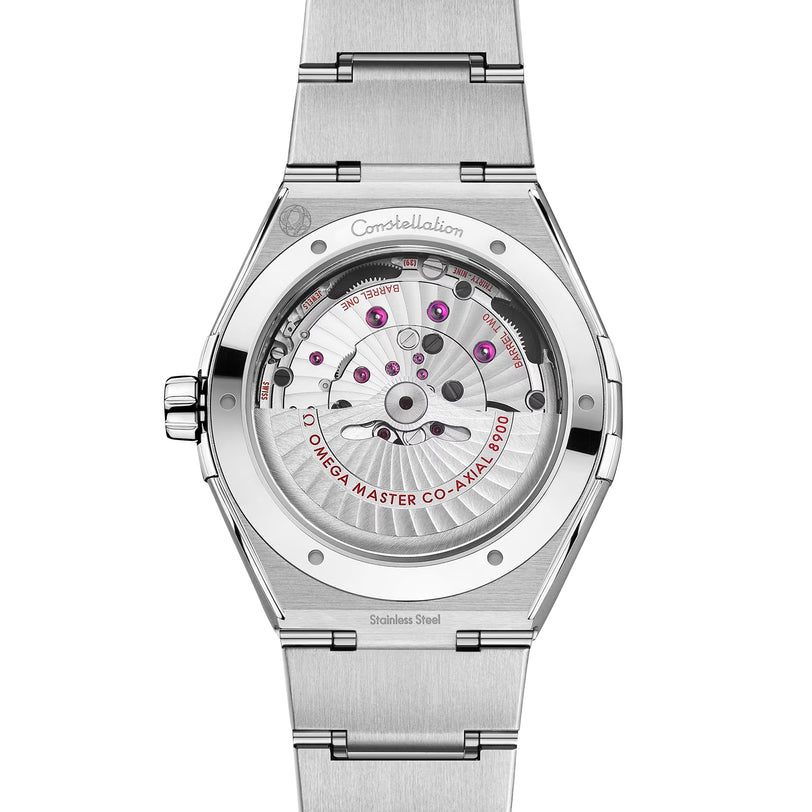Close-up of the OMEGA Constellation, highlighting its transparent case back and detailed mechanical movement within a stainless steel case and bracelet.