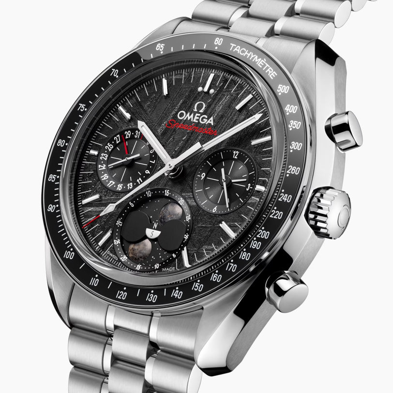 Close-up of the OMEGA Speedmaster Moonphase featuring a stainless steel band, black textured dial, chronograph subdials, and a bezel marked Tachymètre.