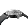 Side view of the Raymond Weil Millesime Automatic Small Seconds Silver Sector Dial, showcasing its grey leather strap, round stainless steel case, and textured dial reflecting classic horology with traditional analog display.