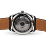 Back view of the Longines Master Collection watch showcases the L897.2 calibre through a transparent case and features a brown leather strap.