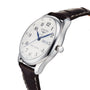 A Longines Master Collection watch featuring a silver case, white dial, blue hands, Arabic numerals, brown leather strap, visible date set to December 9, and powered by the precise L897.2 calibre movement.