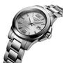 The Longines Conquest watch features a stainless steel design, silver dial, metal bracelet, date at 3 o’clock, and luminous hands and markers—offering performance elegance and timeless style.