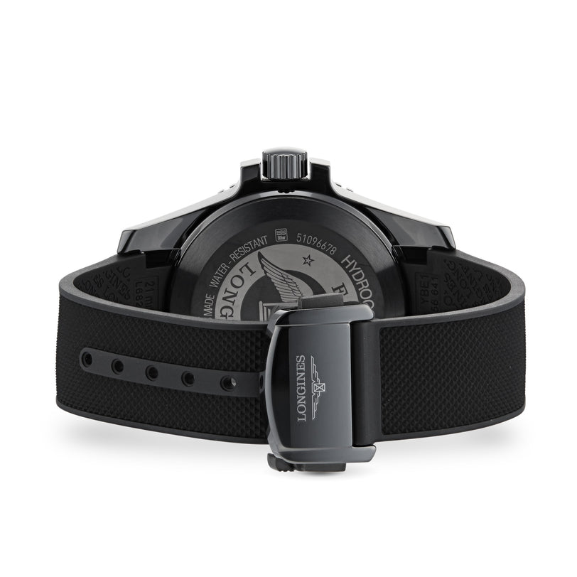 The image displays the back view of the Longines HydroConquest, highlighting its black rubber strap and a case back engraved with the brand logo and details of its automatic movement.