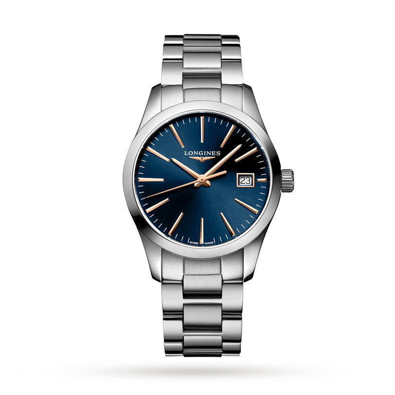 The Longines Conquest Classic wristwatch features a stainless steel case, blue dial, silver and gold hour markers, date display at 3 oclock, and a stylish metal link bracelet.