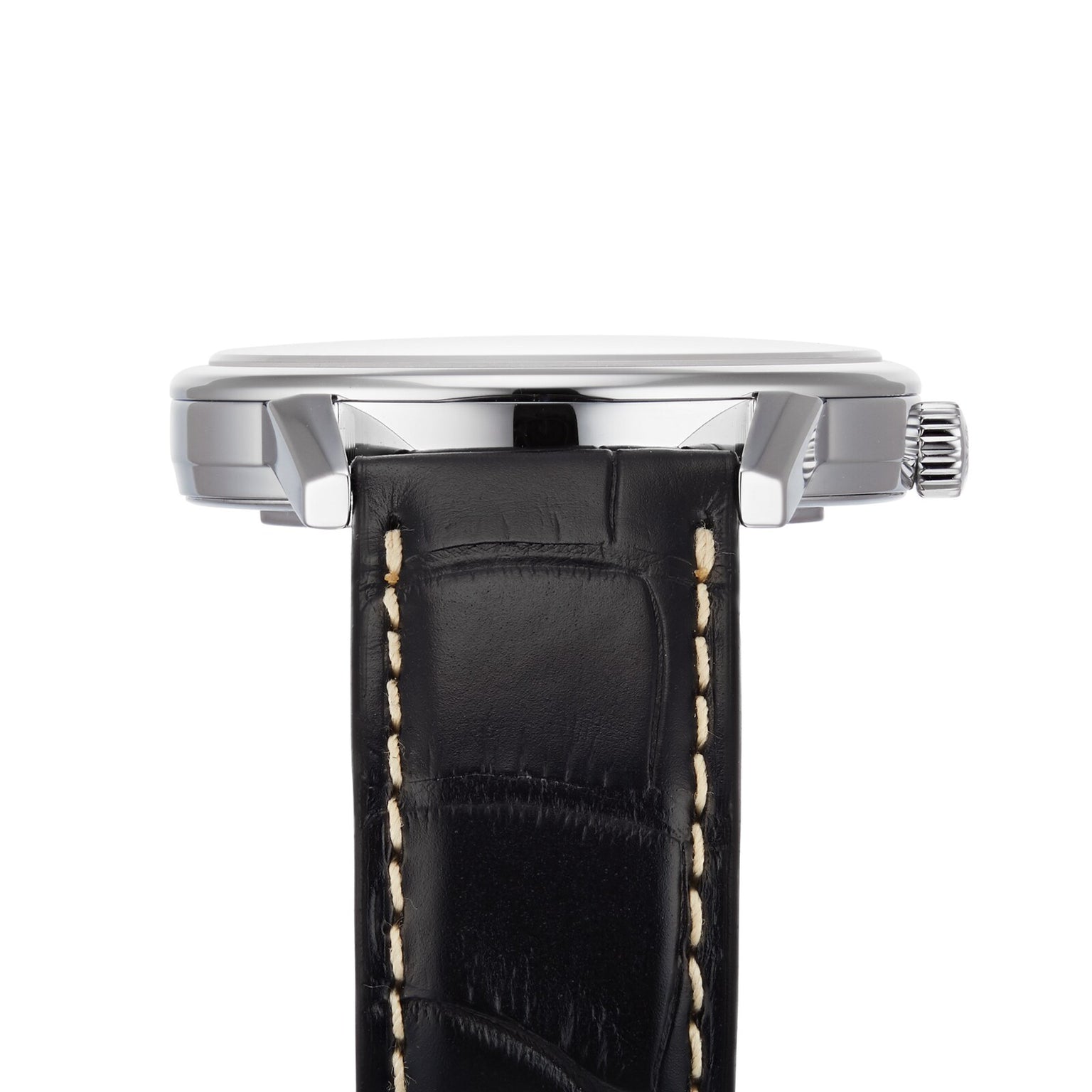 Side view of the Longines Flagship Heritage wristwatch with a black leather strap featuring white stitching, Swiss Super-LumiNova accents, and a silver case with crown on the right side.