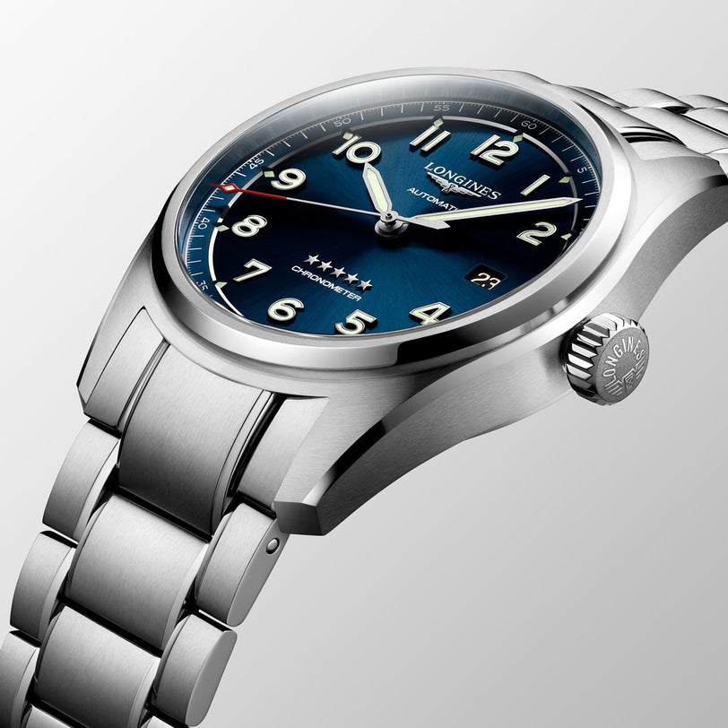 The Longines Spirit Prestige Edition features a stainless steel case, blue dial with silver hour markers, and metal bracelet—reflecting the brand’s pioneering spirit and esteemed aviation heritage.