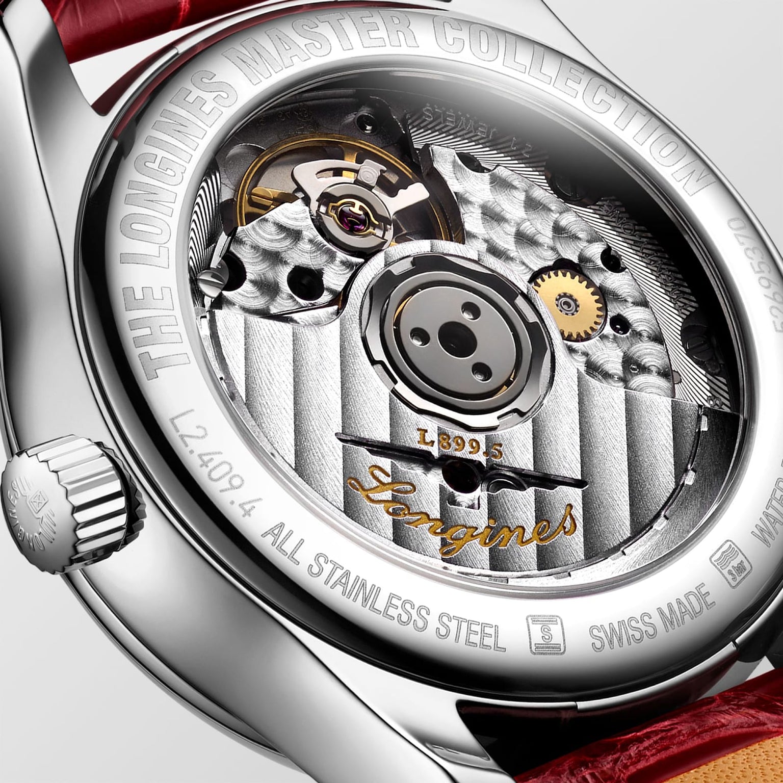 Close-up of the back of the Longines Master Collection Moonphase watch, highlighting its L899 calibre movement, engraved details, and stainless steel case.